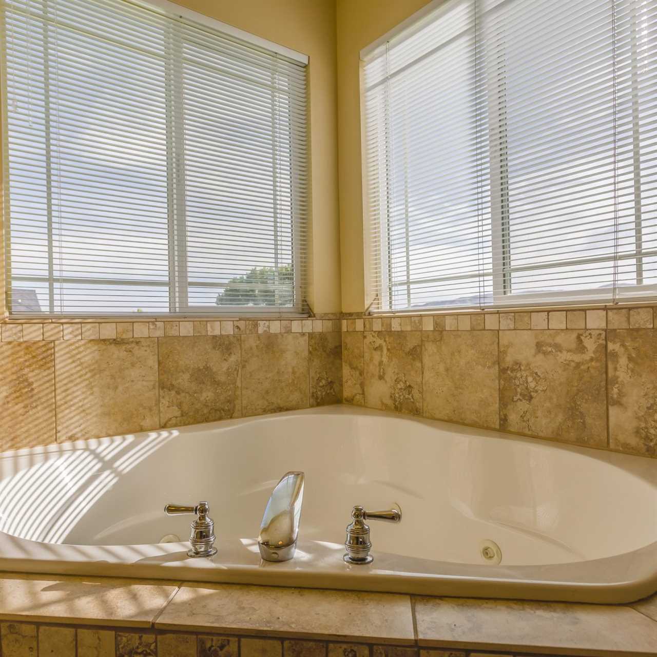 Jetted corner bathtub in modern home